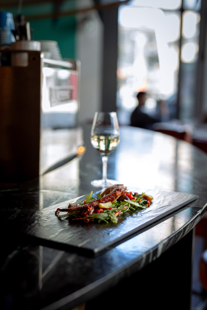 Grilled octopus with arugula and white wine at Pintxo